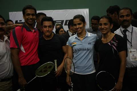 Aamir Khan and badminton ace Saina Nehwal play an exhibition match at launch of 'PULLELA GOPICHAND'Book in Mumbai