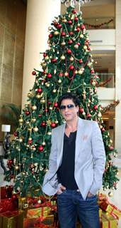 Shah Rukh Khan posing with a Christmas Tree in a Christmas Special photo shoot at Hotel Trident