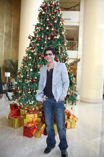 Shah Rukh Khan posing with a Christmas Tree in a Christmas Special photo shoot at Hotel Trident