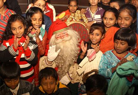 Celebrating the spirit of Christmas the official Santa Claus from Lapland ,Finland with underprivileged children at Le Meridien ,in New Delhi. .