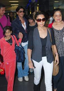 Shah Rukh Khan with wife Gauri and Kids snapped at Airport returns from their vacation