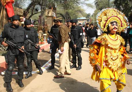 Haryana Police Commandos with a Chhau folk artist at the 26th Surajkund Craft Mela, Faridabad