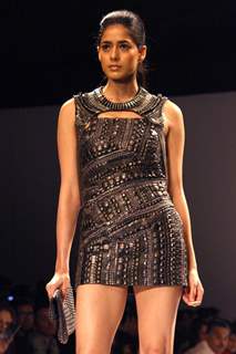 Bollywood actress Chitrangada Singh displays a creation by designer Kanika Saluja Choudhry at the Wills Lifestyle India Fashion week 2012,in New Delhi. .