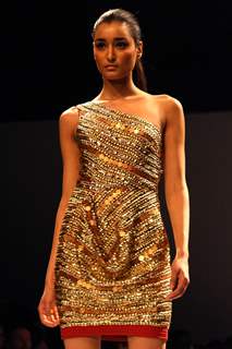 Bollywood actress Chitrangada Singh displays a creation by designer Kanika Saluja Choudhry at the Wills Lifestyle India Fashion week 2012,in New Delhi. .