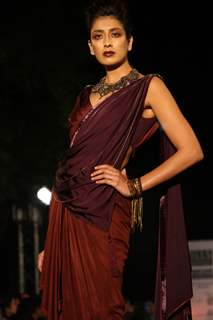 A model displays a creation by designer Tarun Tahiliani at the Wills Lifestyle India Fashion week 2012,in New Delhi on Thursday. .