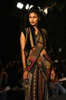 A model displays a creation by designer Tarun Tahiliani at the Wills Lifestyle India Fashion week 2012,in New Delhi on Thursday. .