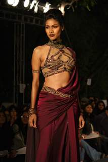 A model displays a creation by designer Tarun Tahiliani at the Wills Lifestyle India Fashion week 2012,in New Delhi on Thursday. .