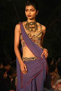 A model displays a creation by designer Tarun Tahiliani at the Wills Lifestyle India Fashion week 2012,in New Delhi on Thursday. .