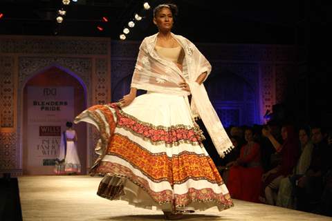 A model displays a creation by designer Manish Malhotra at the Wills Lifestyle India Fashion week 2012,in New Delhi on Friday. .