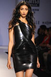 A model displays a creation by designer Rimzim Dadu at the Wills Lifestyle India Fashion week 2012,in New Delhi on Friday. .