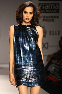 A model displays a creation by designer Rimzim Dadu at the Wills Lifestyle India Fashion week 2012,in New Delhi on Friday. .