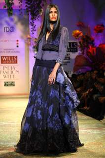 A model displays a creation by designer Tarun Tahiliani  during a special show at the Wills Lifestyle India Fashion week 2012,in New Delhi on Friday. .