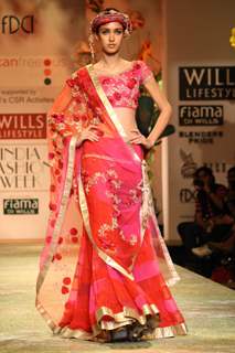 A model displays a creation by designer Suneet Verma  during a special show at the Wills Lifestyle India Fashion week 2012,in New Delhi on Friday. .