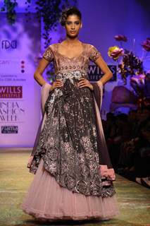 A model displays a creation by designer Ritu Beri  during a special show at the Wills Lifestyle India Fashion week 2012,in New Delhi on Friday. .