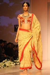 A model displays a creation by designer Rocky S at the Wills Lifestyle India Fashion week 2012,in New Delhi on Saturday. .