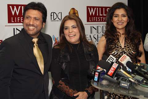 Bollywood actor Govinda and daughter Narmada with designer ReynuTaandon at the  Wills Lifestyle India Fashion week 2012,in New Delhi on Sunday. .