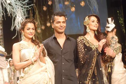 Sisters Malaika Arora Khan and Amrita Arora walk the ramp for designer Vikram Phadnis on day 1 of the Lakme Fashion Week at Grand Hyatt in Mumbai. .