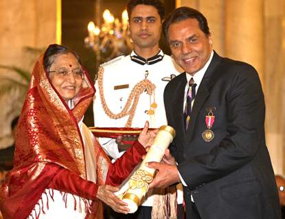 President Pratibha Devisingh Patil, presenting the Padma Bhushan Award to Dharmendra Deol, at Rashtrapati Bhavan, in New Delhi on Wednesday. .