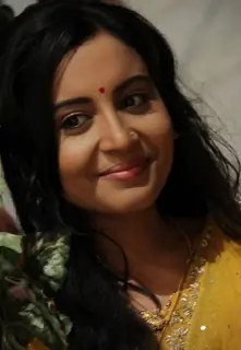 Runjhun in a yellow sari