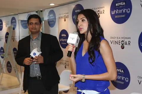 Anushka Sharma gestures during the launch of Nivea’s Go Sleeveless Campaign in Mumbai