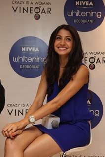 Anushka Sharma gestures during the launch of Nivea’s Go Sleeveless Campaign in Mumbai