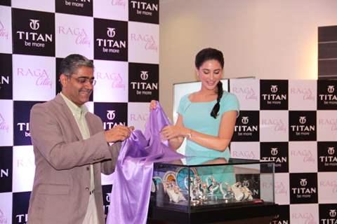 Bollywood actress Nargis Fakhri with Mr Ajoy Chawla,Vice president,Titan unveiling of the exquisite Raga Cities Collection of watches by Titan at World of Titan store in Bandra, Mumbai.