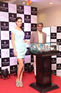 Bollywood actress Nargis Fakhri with Mr Ajoy Chawla,Vice president,Titan unveiling of the exquisite Raga Cities Collection of watches by Titan at World of Titan store in Bandra, Mumbai.