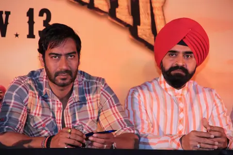 Bollywood actor Ajay Devgan and Congress leader Charan Singh Sapra at Son Of Sardaar press meet to resolve issues with Sikh Community leaders at Hotel Novotel in Juhu, Mumbai.