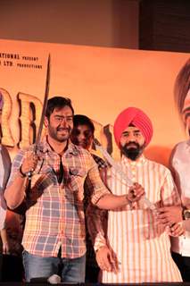 Bollywood actor Ajay Devgan and Congress leader Charan Singh Sapra at Son Of Sardaar press meet to resolve issues with Sikh Community leaders at Hotel Novotel in Juhu, Mumbai.