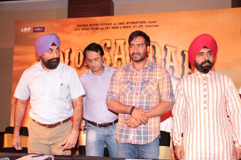 Bollywood actor Ajay Devgan and Congress leader Charan Singh Sapra at Son Of Sardaar press meet to resolve issues with Sikh Community leaders at Hotel Novotel in Juhu, Mumbai.