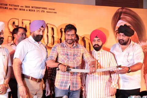 Bollywood actor Ajay Devgan with Congress leader Charan Singh Sapra and other members of Punjabi Cultural Heritage Board (PCHB) at Son Of Sardaar press meet to resolve issues with Sikh Community leaders at Hotel Novotel in Juhu, Mumbai.