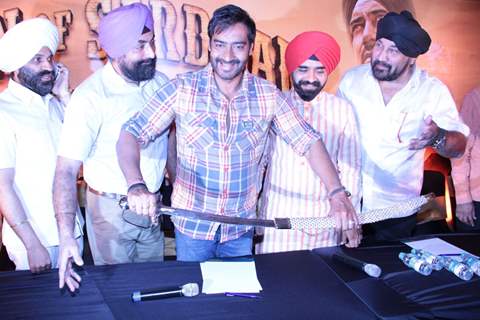 Bollywood actor Ajay Devgan with Congress leader Charan Singh Sapra and other members of Punjabi Cultural Heritage Board (PCHB) at Son Of Sardaar press meet to resolve issues with Sikh Community leaders at Hotel Novotel in Juhu, Mumbai.