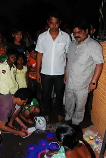 Shankar Nangre distributing Sweets and Fire Crackers to the underprivileged children