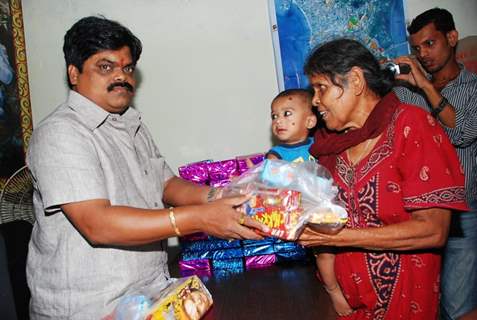 Shankar Nangre distributing Sweets and Fire Crackers to the underprivileged children