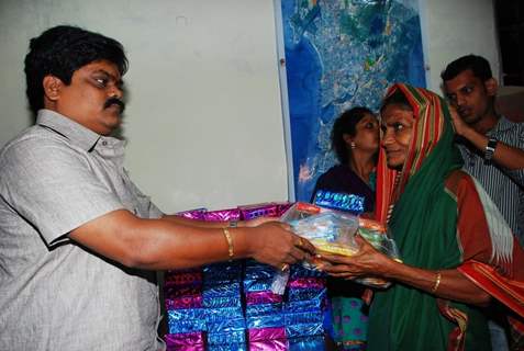 Shankar Nangre distributing Sweets and Fire Crackers to the underprivileged children