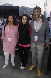 (L to R) Devika Bhojwani, bollywood actors Karisma Kapoor and Milind Soman at the first edition of Pinkathon International 10k women's run for breast cancer awareness at Bandra Kurla Complex in Mumbai.