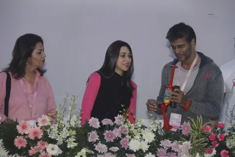(L to R) Devika Bhojwani, bollywood actors Karisma Kapoor and Milind Soman at the first edition of Pinkathon International 10k women's run for breast cancer awareness at Bandra Kurla Complex in Mumbai.