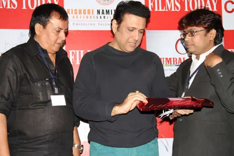 Bollywood actor Govinda with Rajesh Shrivastava, CMD, Films Today, filmmaker Raju Kariya during the launch of the 7th anniversary issue of 'Films Today' magazine in Mumbai.