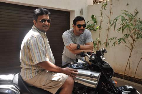 John Abraham gifts his favourite bike to director Sanjay Gupta