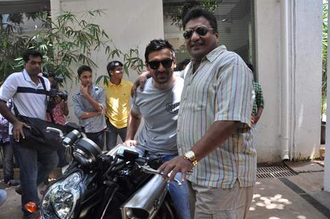 John Abraham gifts his favourite bike to director Sanjay Gupta