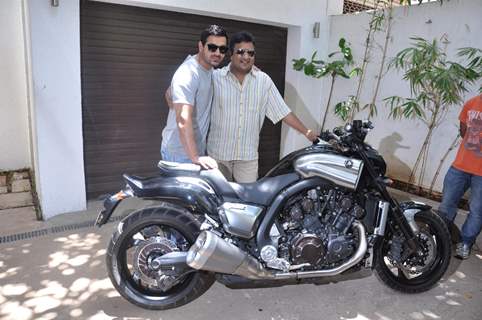 John Abraham gifts his favourite bike to director Sanjay Gupta