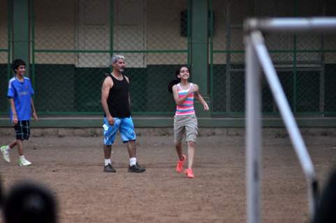 Aamir Khan playing football with his family