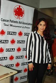 Indian Bollywood actress Neetu Chandra and pop singer Neha Bhasin at a cancer screening camp organised by the Cancer Patient Aid Association (CPAA) with Mumbai