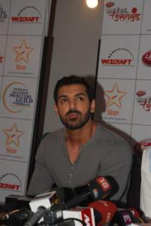 John Abraham patiently listens at the donation drive