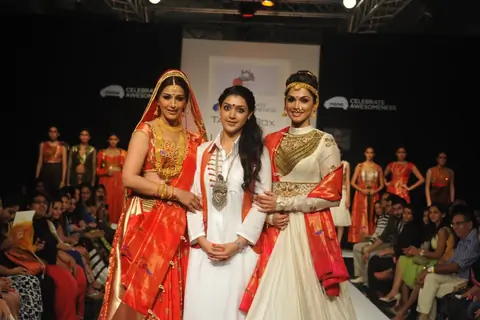 Esha Kopikar and Sonali Bendre showcase a creation of talent box at LAKME FASHION WEEK 2013