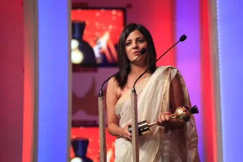 Rucha Pathak  receiving an award at the SAIFTA award ceremony