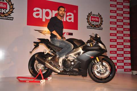 John Abraham poses with his new super bike Aprilia RSV4