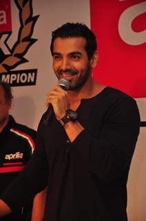 John Abraham poses with his new super bike Aprilia RSV4