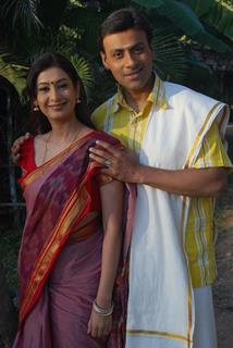 A still image of Anupam Bhattacharya and Payal Nair