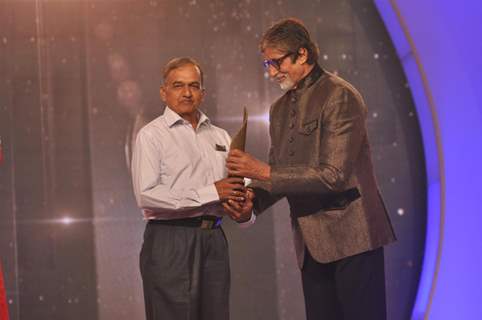 Amitabh Bachchan felicitates a Senior Citizen at the  Awards Ceremony